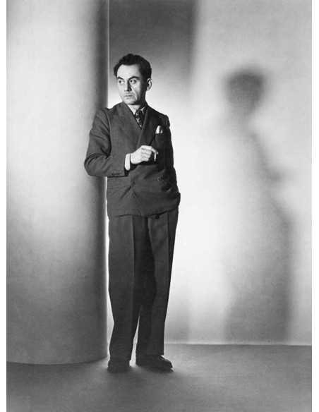 Man Ray full-length selfportrait of Man Ray leaning against a colum...
