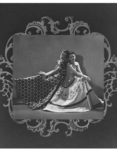 Dress by Lucien Lelong two models sitting back to back in long dres...