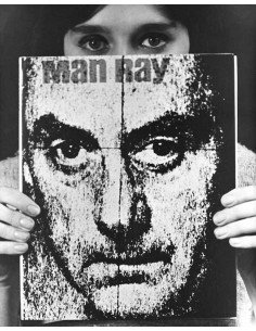 Selfportrait woman holding poster cover of Man Ray's book selfportr...