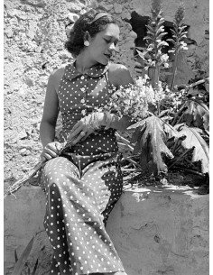 Ady in garden Ady (Adrienne Fidelin) with polka dot dress, carrying...