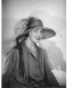 Unidentified woman portrait of smiling woman with flowered hat, bus...
