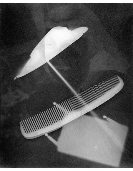 comb Rayography, comb and rod, face in background comb