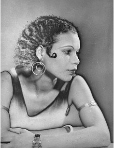 Daïs profile portrait mixed race woman in bust leaning, arms crosse...