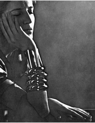 Jacqueline Godard profile portrait woman bracelets leaning on her e...