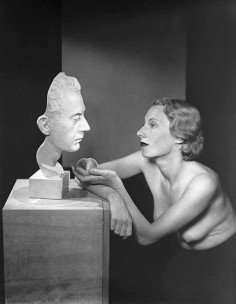 Man Ray's mask and woman unidentified woman, shirtless, in profile ...